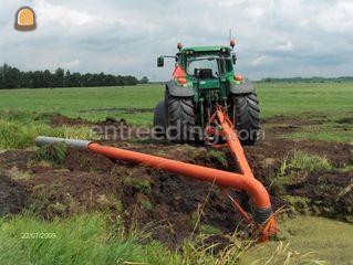 John Deere + vlinderpomp Omgeving Kamerik