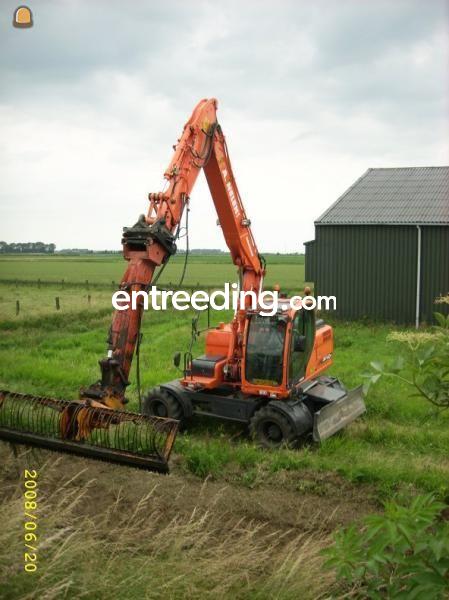 Doosan met verlenggiek en maaikorf