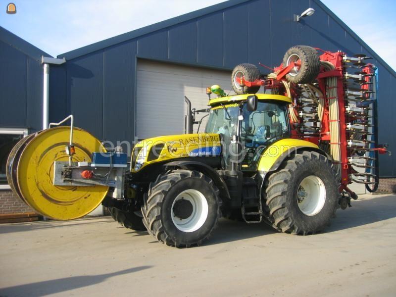 New Holland t 7030 met Baars sleepslang